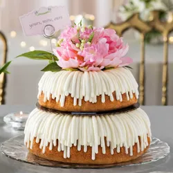 A tiered Bundt cake with white icing